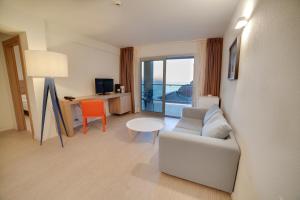 a living room with a couch and a table at Riviera Vista in Playa del Cura