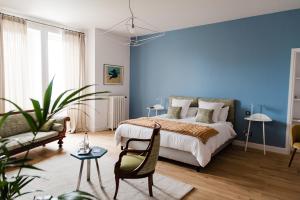 Postel nebo postele na pokoji v ubytování La Villa Guy & Spa - Teritoria