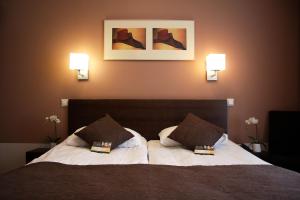 Un pat sau paturi într-o cameră la City Hotel Tallinn by Unique Hotels
