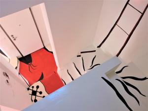a room with graffiti on the walls at Miro' Holiday Attic in Bologna