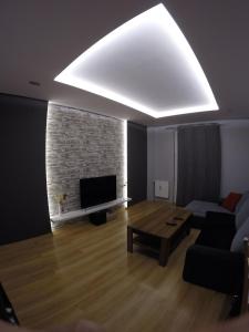 a living room with a couch and a fireplace at A3XD Apartament 2 in Częstochowa