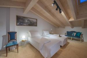 La Gazza Ladra Apartments - Garda Chill Out tesisinde bir odada yatak veya yataklar
