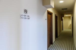 a hallway with a sign on the wall at Agamemnon Hotel in Nafplio