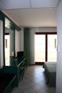Postel nebo postele na pokoji v ubytování Hotel Miralonga