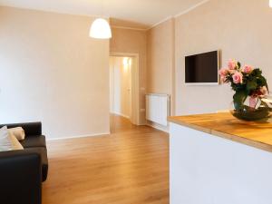 A television and/or entertainment centre at Les Suites