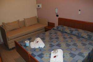 Ліжко або ліжка в номері Hotel Oblio