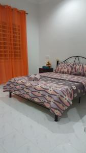 Postel nebo postele na pokoji v ubytování Mama Iman Guestroom