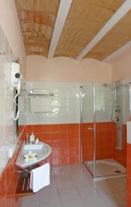 a bathroom with a shower and a sink at Hotel Rural Can Maries in Puerto de San Miguel
