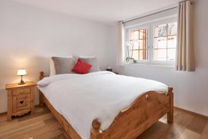 Postel nebo postele na pokoji v ubytování Chandolin Boutique Hotel