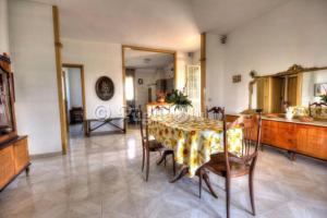 a dining room with a table and some chairs at Villa Portalga al mare in Polignano a Mare