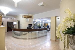 a lobby of a hotel with a reception desk at Hotel Lord Krosno in Krosno