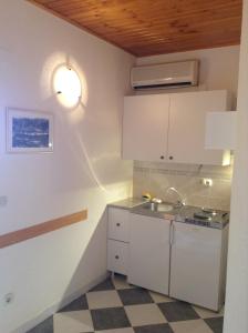 Kuchyň nebo kuchyňský kout v ubytování Apartments Bianki