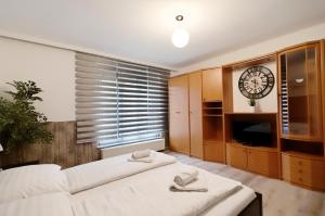 Een bed of bedden in een kamer bij Manu Apartment