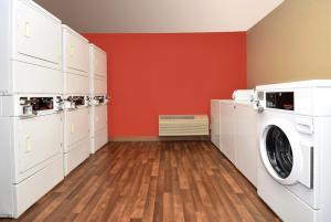 a laundry room with a washer and dryer at Extended Stay America Suites - St Louis - St Peters in Saint Peters