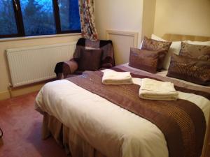 מיטה או מיטות בחדר ב-Westgrange House Bed & Breakfast