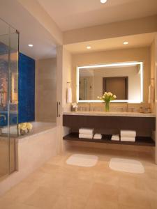 a bathroom with a sink and a mirror at Thunder Valley Casino Resort in Lincoln