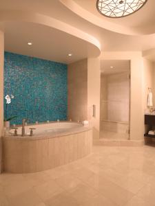 a large bathroom with a tub and a shower at Thunder Valley Casino Resort in Lincoln