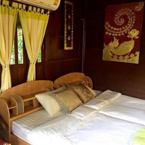 Postel nebo postele na pokoji v ubytování Panpim Resort