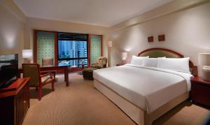 Postel nebo postele na pokoji v ubytování The Sultan Hotel & Residence Jakarta