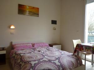 Postel nebo postele na pokoji v ubytování Residence Costablu
