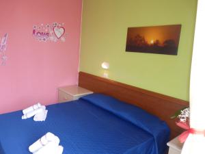 Postel nebo postele na pokoji v ubytování Residence Costablu