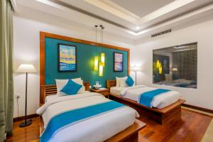 Voodi või voodid majutusasutuse The Tito Suite Residence toas