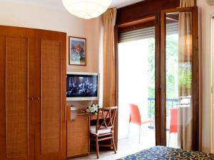 TV a/nebo společenská místnost v ubytování Hotel Horizonte