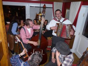 a group of people playing instruments at a party at Pension Edelweiss in Breitenbach am Inn