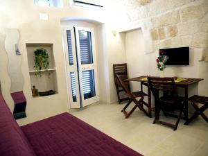 Un televizor și/sau centru de divertisment la Le Arcate