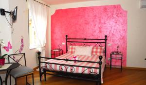 Posteľ alebo postele v izbe v ubytovaní L'Iris B&B