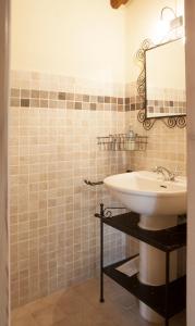 a bathroom with a sink and a mirror at Fattoria Poggio Capponi in Montespertoli