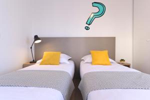 Cama o camas de una habitación en Apparteo Bordeaux