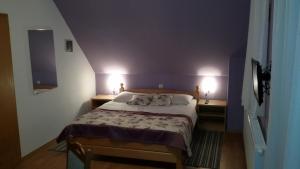 Posteľ alebo postele v izbe v ubytovaní Guest House Wolf