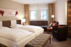 Postel nebo postele na pokoji v ubytování Hotel Ritter Durbach