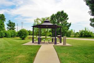 a gazebo with benches on a sidewalk in a park at Extended Stay America Suites - St Louis - O' Fallon, IL in O'Fallon
