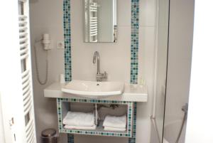Ванная комната в Hôtel & SPA Rodier