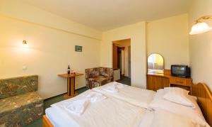 Posteľ alebo postele v izbe v ubytovaní Hotel Nostra