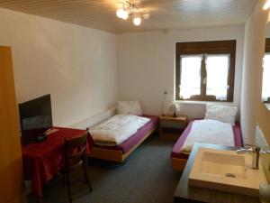 Postel nebo postele na pokoji v ubytování Hotel Restaurant Schiff
