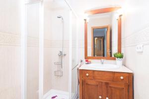 a bathroom with a sink and a shower at Ca Na Dora in Santanyi +20 photos