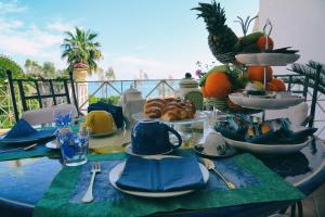 a table with a plate of food on top at B&B L'ORIZZONTE in Crotone