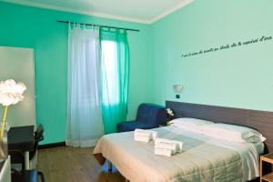 Postel nebo postele na pokoji v ubytování Le Stanze di Boccadasse