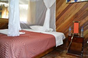 Säng eller sängar i ett rum på Shandia Lodge