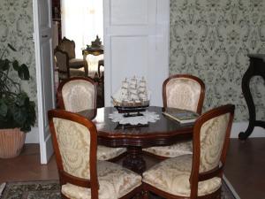 a dining room with a table and four chairs at B&B Domenico Cesarelli in Arena