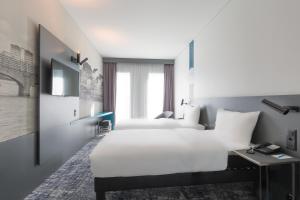 Postelja oz. postelje v sobi nastanitve ibis Styles Basel City