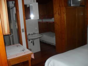 En eller flere senger på et rom på Albergo La Genzianella