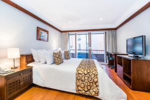 Cama o camas de una habitación en Travelers Condominio Plenitud