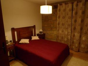 Uma cama ou camas num quarto em Alojamento Rural Casa da Eira
