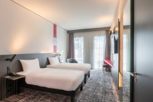 Postelja oz. postelje v sobi nastanitve ibis Styles Basel City