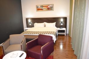 Rúm í herbergi á Havana Hotel