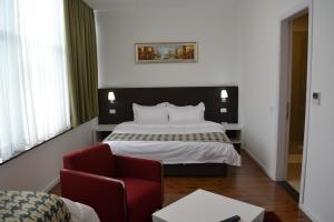 Rúm í herbergi á Havana Hotel